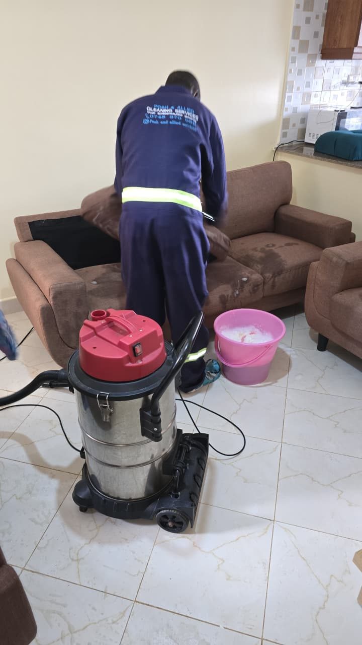 Posh & Allied technician deep-cleaning a sofa in Kenya
